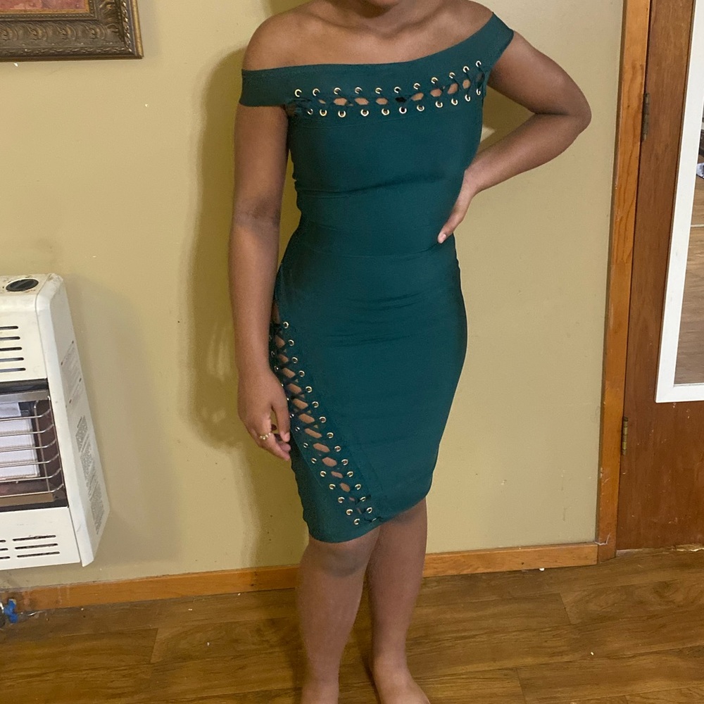 Green fitted dress with gold trim